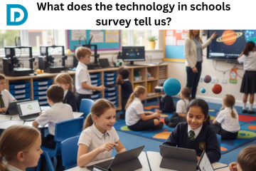  A group of primary school-aged children in uniform are engaged in a classroom setting featuring digital technology. In the foreground, two girls smile while working on laptops or tablets at a table. Other students are seated at desks with devices or gathered on a brightly colored rug. A teacher is visible near a large interactive screen displaying a science lesson on the solar system, with planets digitally overlaid onto the scene.